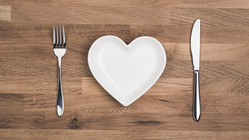 love your favourite food concept, heart on white plate overhead shot